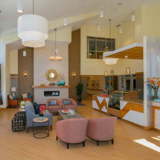 A modern lobby area with stylish furniture and contemporary lighting.