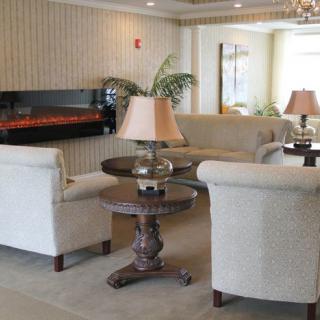 Cozy living room with sofas and a fireplace.