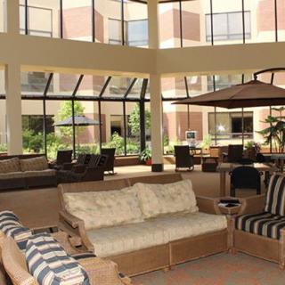 A spacious, modern lobby area with abundant natural light and comfortable seating.