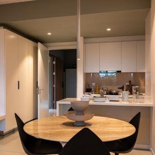 Modern kitchen and dining area with minimalist design.
