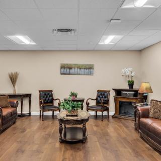A cozy waiting room with comfortable seating and elegant decor.