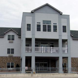 A multi-story residential building with balconies and a modern design.