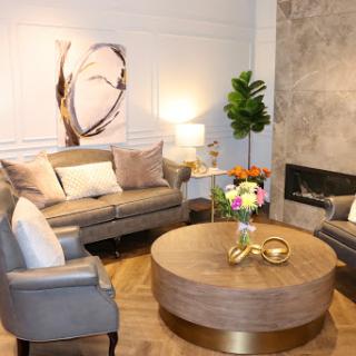 A stylish and modern living room featuring elegant furniture, a cozy atmosphere, and artistic decor.