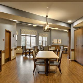 A bright and inviting dining area designed for comfort and social interaction.