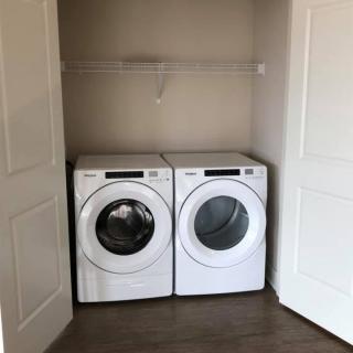 A compact laundry area featuring a washing machine and dryer.