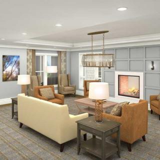 A well-furnished living room with a fireplace and comfortable seating.