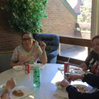 A group of people enjoying a meal together indoors.