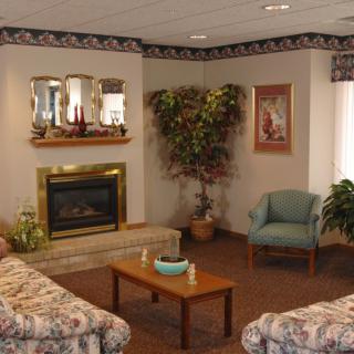 Cozy living room with a fireplace and comfortable seating.