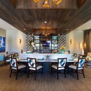 A stylish and modern home bar area with elegant seating and contemporary decor.