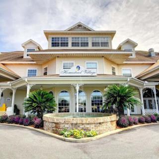 A welcoming hotel entrance featuring elegant architecture and lush landscaping.