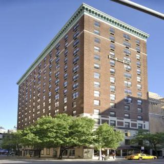 A large brick hotel building in an urban setting.
