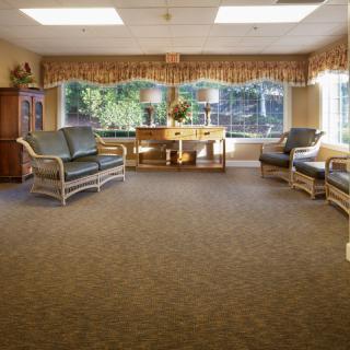 A cozy waiting room with comfortable seating and natural lighting.