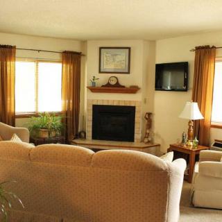 Cozy living room with a fireplace and comfortable seating.