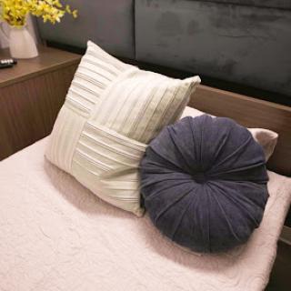 A cozy arrangement of decorative pillows on a bed.