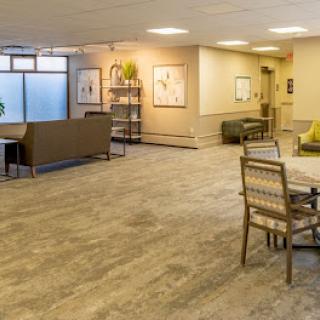 A modern lobby with comfortable seating and decorative elements, creating a welcoming atmosphere.