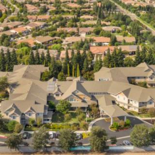 Aerial view of a residential neighborhood with houses and trees.