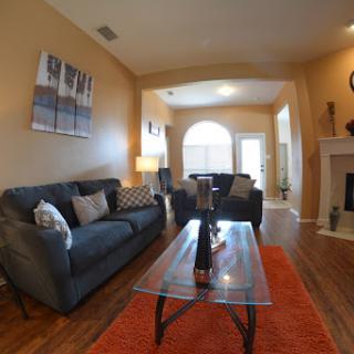 A cozy living room featuring stylish furniture and warm colors.