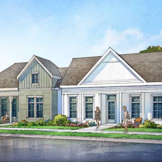 A suburban residential house with a landscaped front yard.