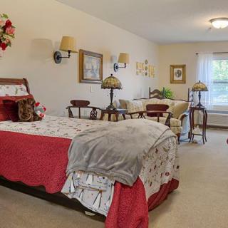 A cozy bedroom with a large bed and elegant decor.