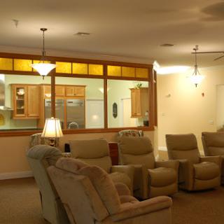 A cozy living room featuring comfortable recliners and warm lighting.