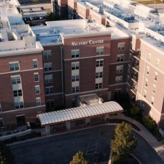 Aerial view of a hospital building with a visible entrance area.