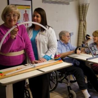Seniors engaging in rehabilitation activities at a nursing home.