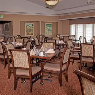 A well-organized dining area with neatly arranged tables and chairs.