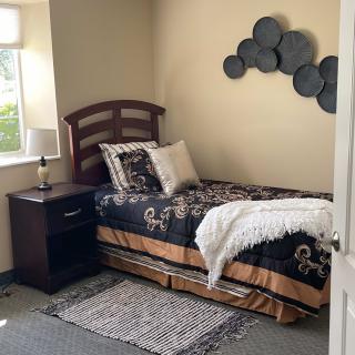Cozy bedroom with a single bed and decorative accents.