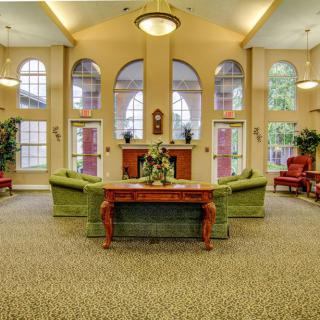 A spacious and elegantly decorated lobby with large windows and comfortable seating areas.