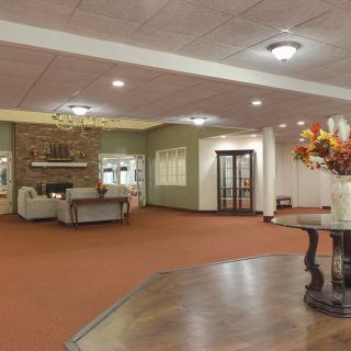 A spacious lobby area with comfortable seating and elegant decor.
