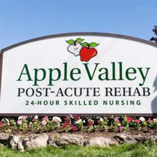 A sign for Apple Valley Post-Acute Rehab, a facility offering 24-hour skilled nursing services.