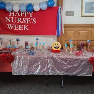 A festive setup celebrating Nurse's Week, featuring colorful decorations and treats to honor healthcare professionals.