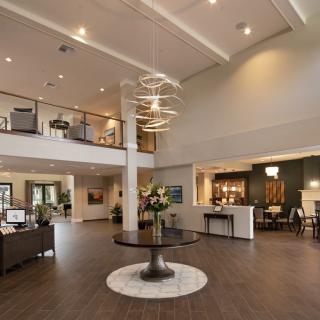 A modern and spacious lobby with elegant lighting and contemporary furnishings.