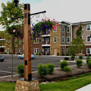 A view of a modern apartment complex with landscaped surroundings.