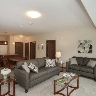 A modern living room with comfortable sofas and elegant decor.