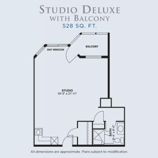 A floor plan of a Studio Deluxe apartment with a balcony measuring 528 sq. ft.