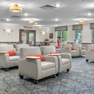 A modern lounge area featuring comfortable seating and a calm atmosphere.