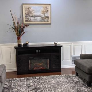 A cozy living room with a fireplace and elegant decor.