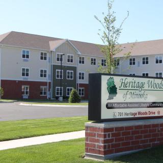 A large building with a sign that reads 'Heritage Health' on a sunny day.