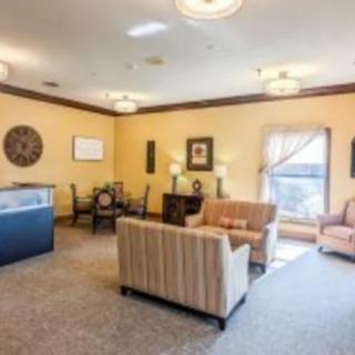 A cozy living room with comfortable seating and elegant decor.