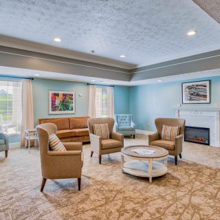 A spacious and elegantly designed living room with comfortable seating and modern decor.