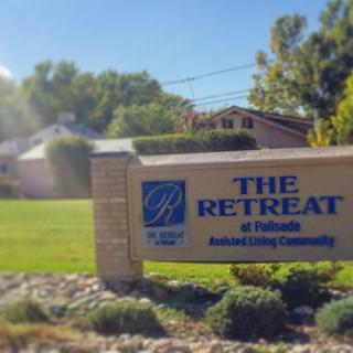 Entrance sign for The Retreat, a senior living community.
