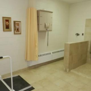 A clinic waiting area with medical equipment and decor.