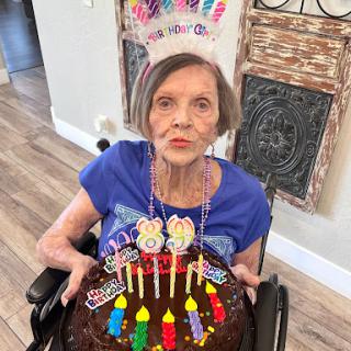 Celebrating a special birthday with cake and smiles.