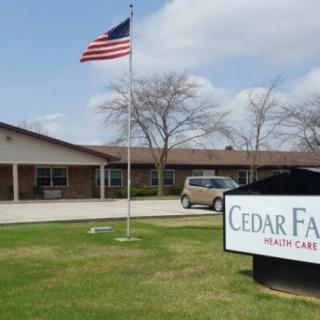 A healthcare facility with an American flag flying outside.