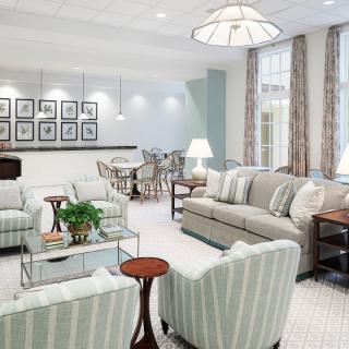 A spacious and elegantly decorated living room with comfortable seating and tasteful decor.