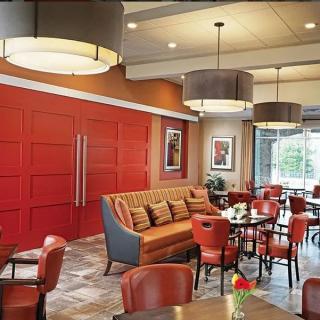A modern restaurant interior with comfortable seating and stylish lighting.
