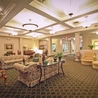 A cozy lobby area with sofas, armchairs, and decorative elements.