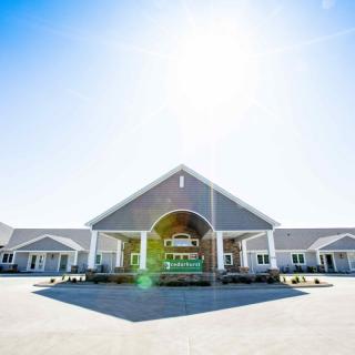A sunny day view of a modern residential building entrance.
