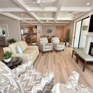 A modern and cozy living room with elegant furniture and open-plan design.